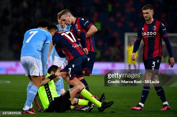 Referee Enzo Maresca falls down during the Serie A match between Bologna FC and SS Lazio at Stadio Renato Dall'Ara on March 11, 2023 in Bologna,...