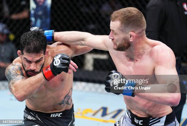 Davey Grant of England punches Raphael Assuncao of Brazil in a bantamweight fight during the UFC Fight Night event at The Theater at Virgin Hotels...