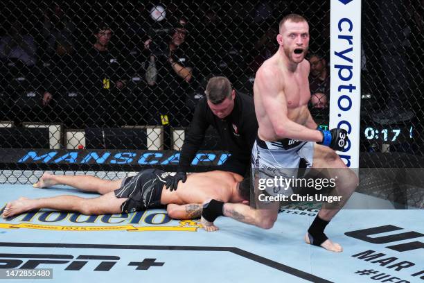 Davey Grant of England reacts after his submission victory over Raphael Assuncao of Brazil in a bantamweight fight during the UFC Fight Night event...