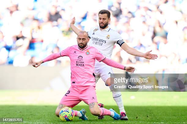 Nacho Fernandez of Real Madrid CF battle for the ball with Aleix Vidal of RCD Espanyol during the LaLiga Santander match between Real Madrid CF and...