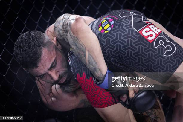 Richard "La Pantera" Jacome and Ernesto "El Potro" Schisano fight during the Mixed Martial Arts competition "WOW 8. El Camino del Guerrero" at...