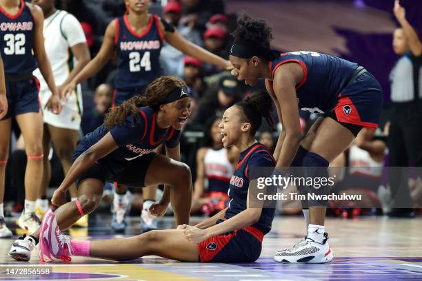 Aziah Hudson, Destiny Howell and Kaniyah Harris of the Howard Lady Bison react during the first half against the Norfolk State Spartans during the...