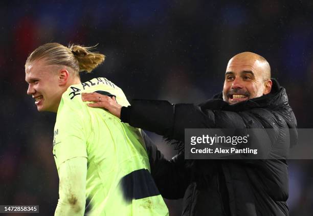 Pep Guardiola of Manchester City celebrates with Erling Haaland of Manchester City after victory during the Premier League match between Crystal...