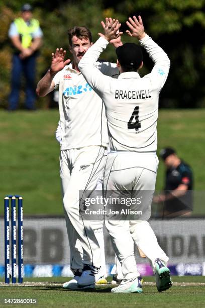 Blair Tickner of New Zealand celebrates with Michael Bracewell of New Zealand after dismissing Prabath Jayasuriya of Sri Lanka during day four of the...