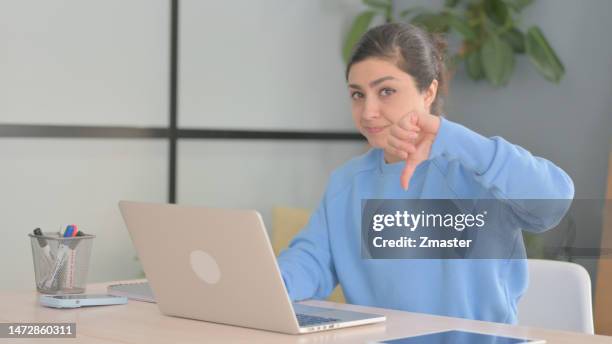 Thumbs Down by Indian Woman Working on Laptop thumbs down indian woman working laptop
