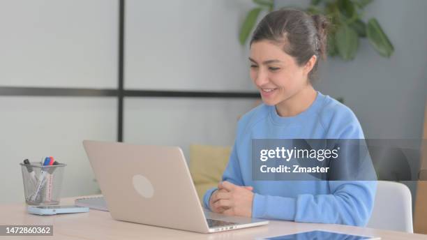 Indian Woman Doing Video Chat on Laptop indian woman doing video chat laptop