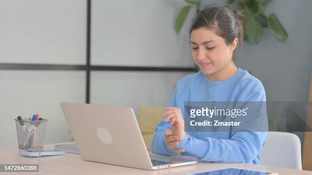 indian woman having wrist pain while