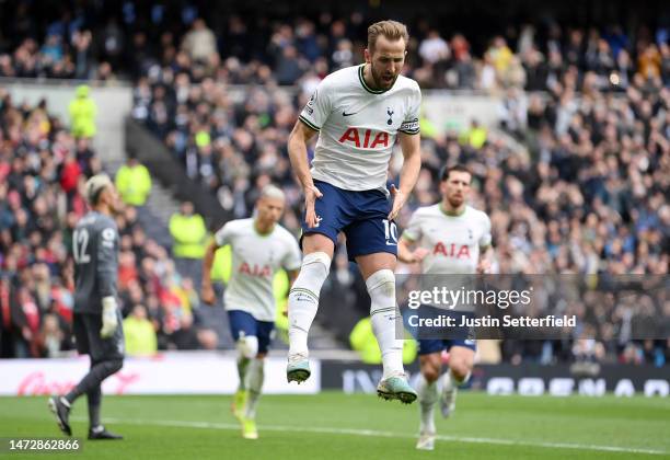 Harry Kane of Tottenham Hotspur celebrates after scoring the team's second goal from the penalty spot during the Premier League match between...