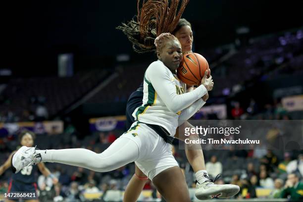 Makoye Diawara of the Norfolk State Spartans and Krislyn Marsh of the Howard Lady Bison challenge for a rebound during the second half during the...