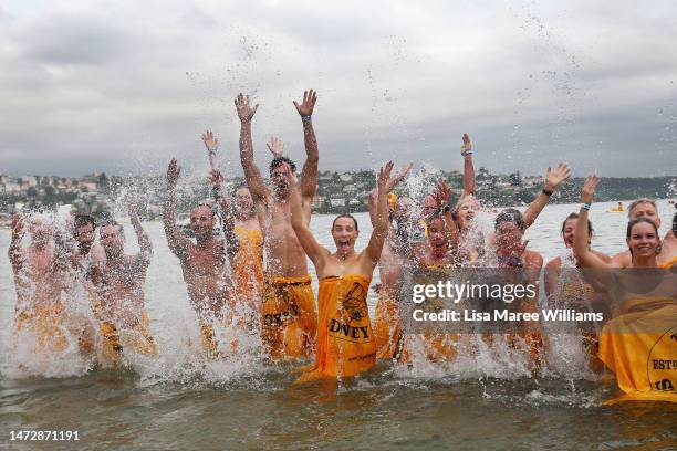 Swimmers celebrate after taking part in the 'Sydney Skinny' on March 12, 2023 in Sydney, Australia. The world's largest annual nude swimming race,...