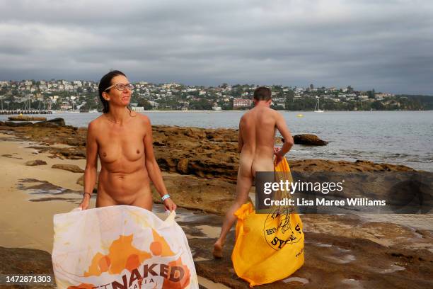 Swimmers wave sarongs after taking part in the 'Sydney Skinny' on March 12, 2023 in Sydney, Australia. The world's largest annual nude swimming race,...