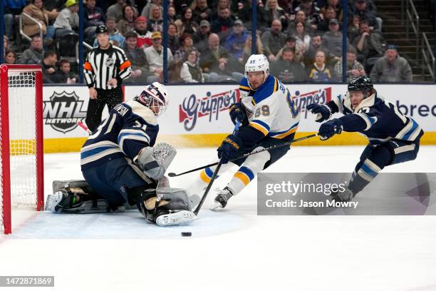 Michael Hutchinson of the Columbus Blue Jackets deflects a shot by Pavel Buchnevich of the St. Louis Blues during the first period at Nationwide...