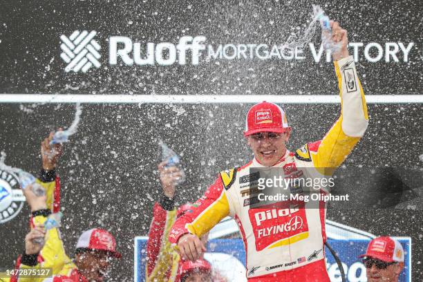 Sammy Smith, driver of the Pilot Flying J Toyota, celebrates in victory lane after winning the NASCAR Xfinity Series United Rentals 200 at Phoenix...