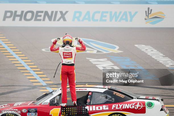 Sammy Smith, driver of the Pilot Flying J Toyota, celebrates after winning the NASCAR Xfinity Series United Rentals 200 at Phoenix Raceway on March...