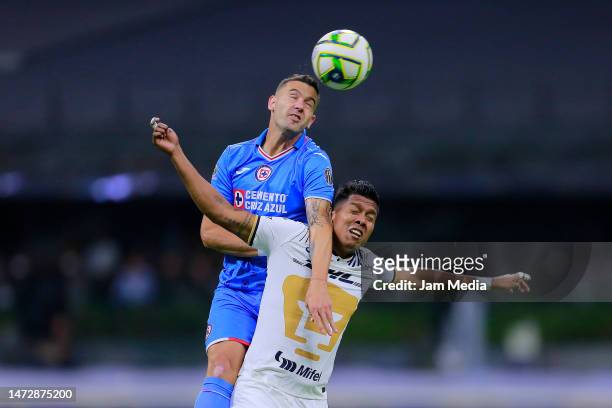 Ramiro Carrera of Cruz Azul fights for the ball with Jonathan Sanchez of Pumas during the 11th round match between Cruz Azul and Pumas UNAM as part...