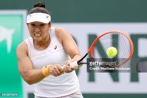 Claire Liu of the United States returns a shot to Iga Swiatek of Poland during the BNP Paribas Open at the Indian Wells Tennis Garden on March 11,...
