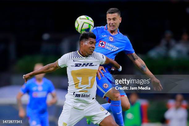 Jonathan Sanchez of Pumas fights for the ball with Ramiro Carrera of Cruz Azul during the 11th round match between Cruz Azul and Pumas UNAM as part...