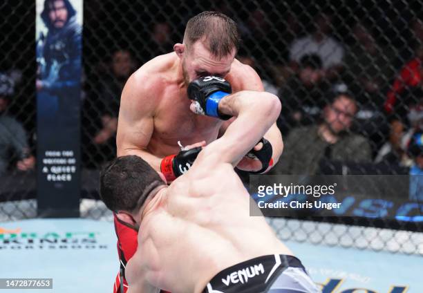 Merab Dvalishvili of Georgia punches Petr Yan of Russia in a bantamweight fight during the UFC Fight Night event at The Theater at Virgin Hotels Las...