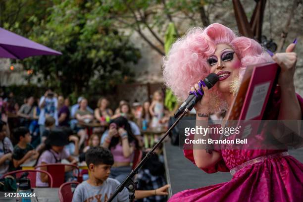 Drag Queen Brigitte Bandit reads a book during a story time reading at the Cheer Up Charlies dive bar on March 11, 2023 in Austin, Texas. Controversy...