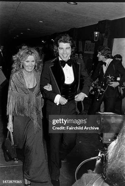 Diana Hyland and John Travolta attend an event at the Santa Monica Civic Auditorium in Santa Monica, California, on November 20, 1976.