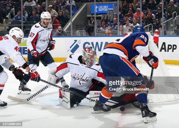 Darcy Kuemper of the Washington Capitals makes the second period save on Brock Nelson of the New York Islanders at the UBS Arena on March 11, 2023 in...