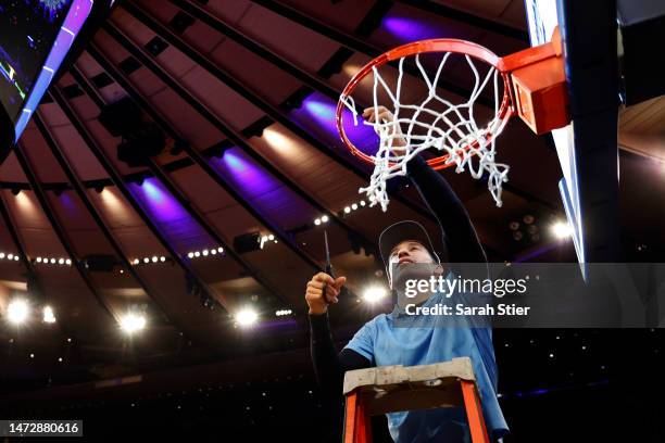 Head coach Shaka Smart of the Marquette Golden Eagles cuts the net after the second half against the Xavier Musketeers in the Big East Basketball...