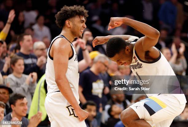 Stevie Mitchell and Kam Jones of the Marquette Golden Eagles react during the second half against the Xavier Musketeers in the Big East Basketball...