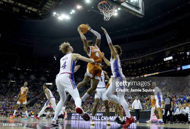 Tyrese Hunter of the Texas Longhorns shoots the ball against the Kansas Jayhawks during second half of the Big 12 Tournament Championship game at...