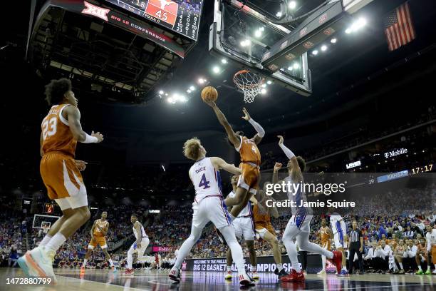 Tyrese Hunter of the Texas Longhorns shoots the ball against the Kansas Jayhawks during second half of the Big 12 Tournament Championship game at...