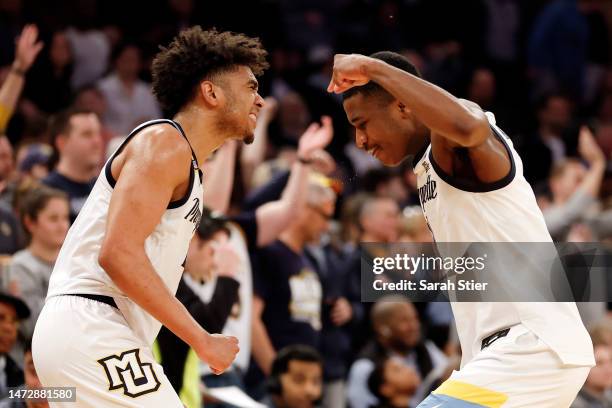 Stevie Mitchell and Kam Jones of the Marquette Golden Eagles react during the second half against the Xavier Musketeers in the Big East Basketball...