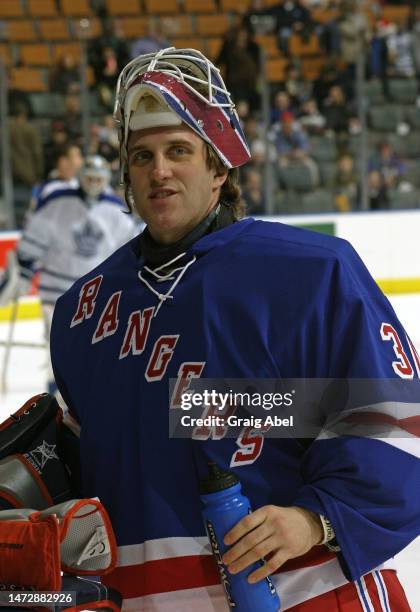 Mike Dunham of the New York Rangers skates against the Toronto Maple Leafs during NHL game action on December 14, 2002 at Air Canada Centre in...