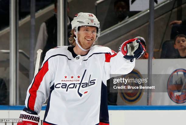 Rasmus Sandin of the Washington Capitals celebrates his third period goal against the New York Islanders at the UBS Arena on March 11, 2023 in...