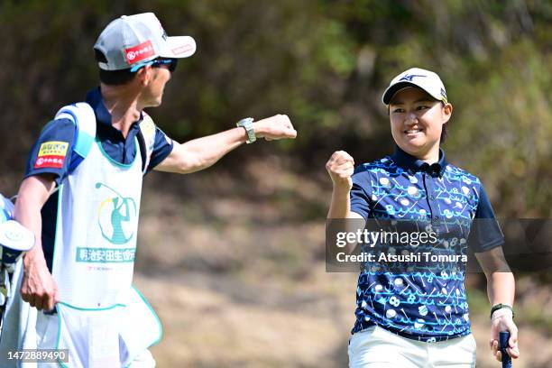 Mao Nozawa of Japan fist bumps with her caddie after the birdie on the 6th green during the final round of Meiji Yasuda Life Insurance Ladies...