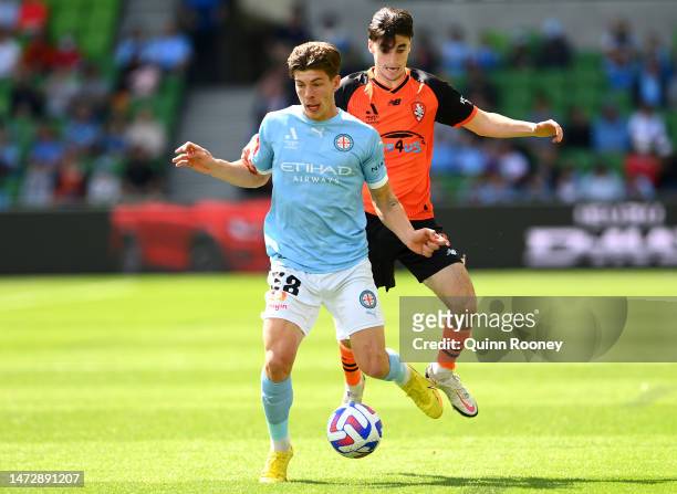Jordan Bos of Melbourne City controls the ball infront of Henry Hore of the Brisbane Roar during the round 20 A-League Men's match between Melbourne...