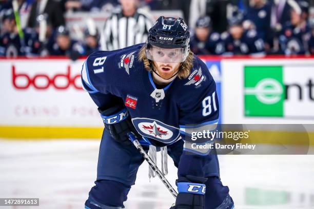 Kyle Connor of the Winnipeg Jets gets set during a second period face-off against the Minnesota Wild at the Canada Life Centre on March 8, 2023 in...