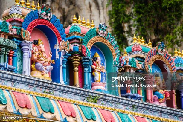 colorful decoration wall of batu caves in kuala lumpur - kuala lumpur culture stock pictures, royalty-free photos & images