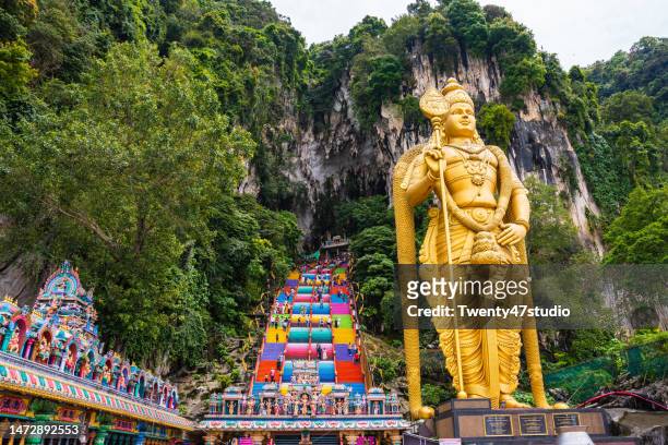 colorful steps to the top of batu caves in kuala lumpur - batu caves stock pictures, royalty-free photos & images