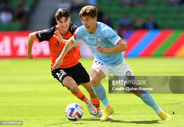 Jordan Bos of Melbourne City controls the ball infront of Henry Hore of the Brisbane Roar during the round 20 A-League Men's match between Melbourne...