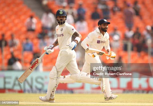 Virat Kohli and Ravindra Jadeja of India make runs during day four of the Fourth Test match in the series between India and Australia at Narendra...