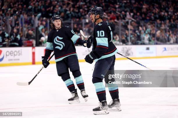 Matty Beniers celebrates his goal with Jared McCann of the Seattle Kraken during the second period against the Dallas Stars at Climate Pledge Arena...