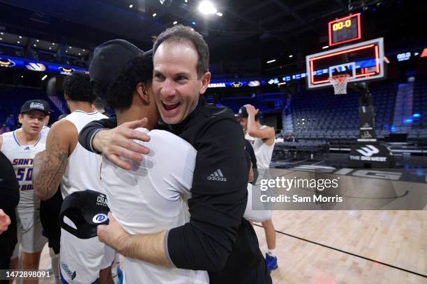 Head coach Joe Pasternack of the UC Santa Barbara Gauchos celebrates with players after they beat Cal State Fullerton in the Big West Conference...