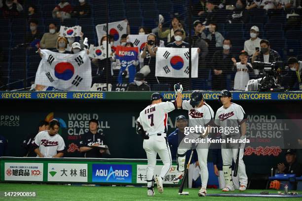 Ha-Seong Kim of Korea celebrates with teammate Jung Hoo Lee after hitting a solo homer to make it 2-7 in the seventh inning during the World Baseball...