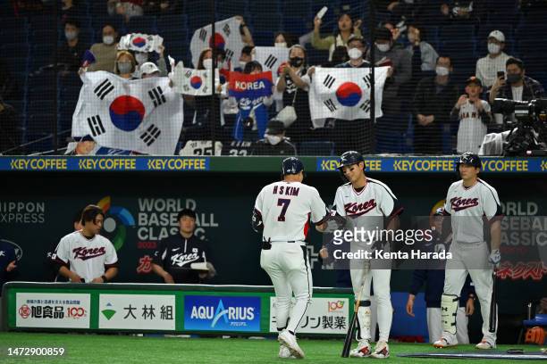 Ha-Seong Kim of Korea celebrates with teammate Jung Hoo Lee after hitting a solo homer to make it 2-7 in the seventh inning during the World Baseball...
