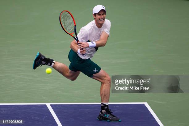 Andy Murray of Great Britain hits a backhand against Radu Albot of Moldova in the second round of the BNP Paribas Open on March 11, 2023 in Indian...