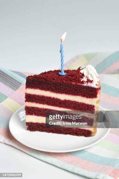 birthday cake with a candle, red velvet cake - cake slices stock-fotos und bilder