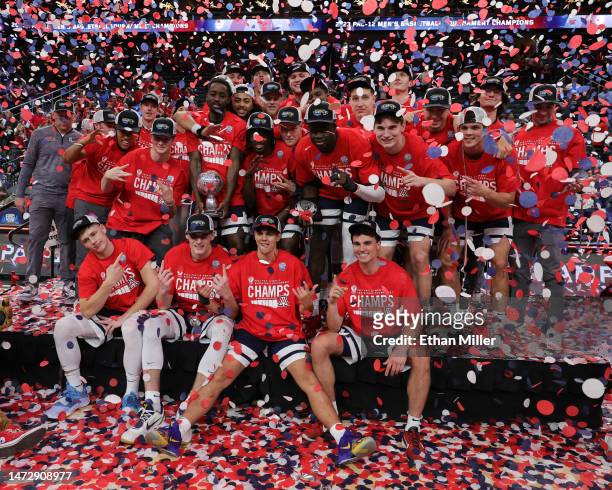 The Arizona Wildcats celebrate their 61-59 victory over the UCLA Bruins to win the championship game of the Pac-12 basketball tournament at T-Mobile...
