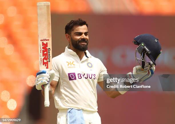 Virat Kohli of India celebrates after scoring his century during day four of the Fourth Test match in the series between India and Australia at...