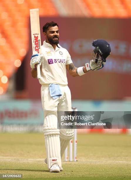 Virat Kohli of India celebrates after scoring his century during day four of the Fourth Test match in the series between India and Australia at...