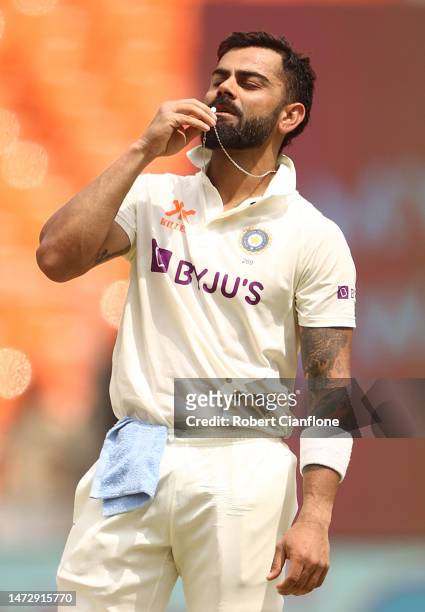 Virat Kohli of India celebrates after scoring his century during day four of the Fourth Test match in the series between India and Australia at...