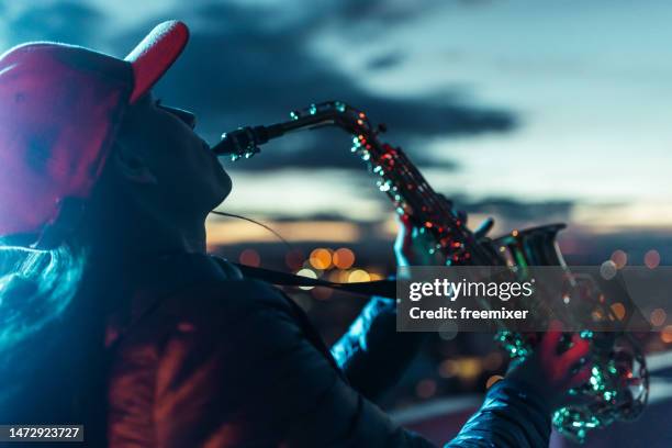 performing under the open sky - saxophone stock pictures, royalty-free photos & images